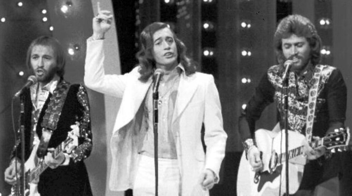 The Bee Gees performing on NBC's The Midnight Special in 1973, six years before Tragedy became their fifth Hot 100 number one of the disco era