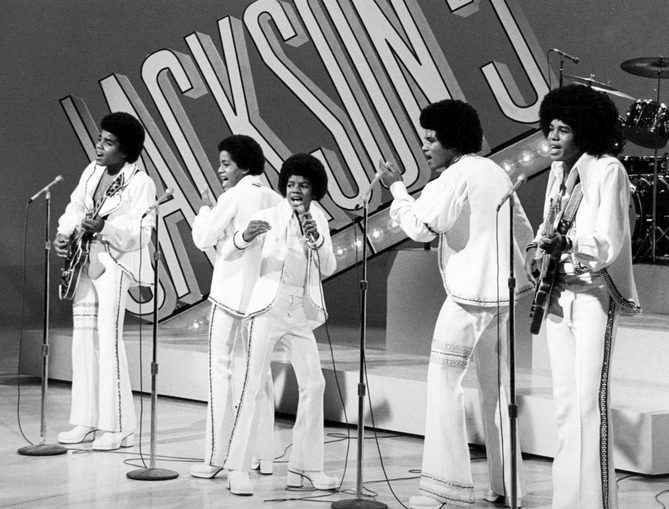 The Jackson 5 performing on stage in 1972 in matching white outfits, the Jackson 5 songs live on television