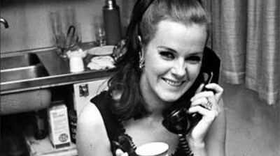 Anni-Frid Lyngstad smiling on the telephone in a 1967 newspaper photo taken the day after her national television debut, years before she became one quarter of ABBA