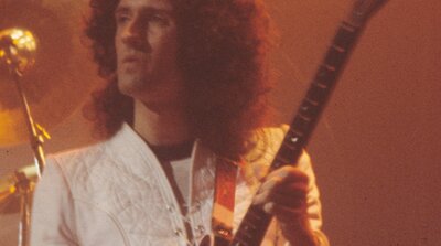 Brian May of Queen playing his homemade Red Special guitar live in November 1977