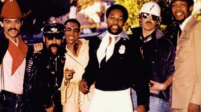 Village People photographed in full costume in 1978, showing the cowboy, biker, Native American chief, police officer, construction worker, and military man characters